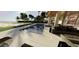 Oceanfront pool and patio with lounge seating, offering stunning ocean views at 6489 Gulfside Rd, Longboat Key, FL 34228