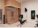 Home gym featuring a sauna and state-of-the-art equipment at 6489 Gulfside Rd, Longboat Key, FL 34228