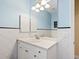 Simple bathroom with single sink and mirror at 7659 Trillium Blvd, Sarasota, FL 34241