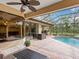 Relaxing pool and patio area with screened enclosure at 7659 Trillium Blvd, Sarasota, FL 34241