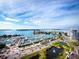 Stunning aerial view of marina, city skyline, and bridges at 800 N Tamiami Trl # 307, Sarasota, FL 34236