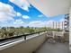 Spacious balcony with patio furniture and scenic views at 800 N Tamiami Trl # 307, Sarasota, FL 34236
