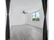Spacious bedroom with ceiling fan and large window at 800 N Tamiami Trl # 307, Sarasota, FL 34236
