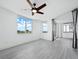 Bright bedroom with ceiling fan and ocean view at 800 N Tamiami Trl # 307, Sarasota, FL 34236