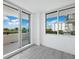 Bright bedroom with balcony access and ocean view at 800 N Tamiami Trl # 307, Sarasota, FL 34236