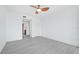 Bright bedroom with ceiling fan and gray vinyl flooring at 800 N Tamiami Trl # 307, Sarasota, FL 34236