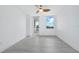 Spacious, airy bedroom with gray wood-look floors and balcony access boasting bright, sun-filled views at 800 N Tamiami Trl # 307, Sarasota, FL 34236