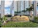 Exterior of Alinari at Rosemary Place with manicured landscaping and water feature in Sarasota, Florida at 800 N Tamiami Trl # 307, Sarasota, FL 34236