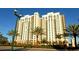 Exterior daytime view of Alinari condos featuring multiple stories and balconies at 800 N Tamiami Trl # 307, Sarasota, FL 34236