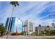 View of city buildings and palm trees along road at 800 N Tamiami Trl # 307, Sarasota, FL 34236