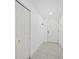 Simple entryway with white doors and light flooring at 800 N Tamiami Trl # 307, Sarasota, FL 34236