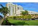 Well-manicured lawn and landscaping in front of Alinari condos, offering a scenic view at 800 N Tamiami Trl # 307, Sarasota, FL 34236