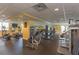 Spacious gym with modern exercise equipment, including treadmills, weight machines, and elliptical trainers at 800 N Tamiami Trl # 307, Sarasota, FL 34236