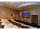 Comfortable home theater with tiered seating, a large screen, and ceiling designs at 800 N Tamiami Trl # 307, Sarasota, FL 34236