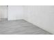 Empty room with light gray wood-look flooring at 800 N Tamiami Trl # 307, Sarasota, FL 34236