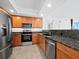 Modern kitchen with stainless steel appliances and granite countertops at 800 N Tamiami Trl # 307, Sarasota, FL 34236