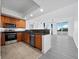 Modern kitchen with stainless steel appliances and granite countertops at 800 N Tamiami Trl # 307, Sarasota, FL 34236