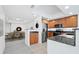 Open concept kitchen with stainless steel appliances and dining area at 800 N Tamiami Trl # 307, Sarasota, FL 34236