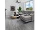 Living room with sectional sofa and large windows at 800 N Tamiami Trl # 307, Sarasota, FL 34236