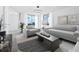 Light and airy living room with modern furniture and ocean view at 800 N Tamiami Trl # 307, Sarasota, FL 34236