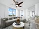 Living room with sectional sofa and a round coffee table at 800 N Tamiami Trl # 307, Sarasota, FL 34236