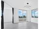 Spacious living room with large windows and ocean view at 800 N Tamiami Trl # 307, Sarasota, FL 34236