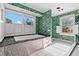 Spacious bathroom featuring a large bathtub and plenty of natural light at 810 S Edison Ave, Tampa, FL 33606