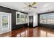 Bright bedroom with hardwood floors and access to a private balcony at 810 S Edison Ave, Tampa, FL 33606