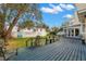 Spacious backyard deck with seating area, overlooking a grassy yard at 810 S Edison Ave, Tampa, FL 33606