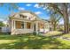 Large two-story home with a wrap-around porch and two-car garage at 810 S Edison Ave, Tampa, FL 33606