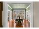 Elegant dining room with hardwood floors, floral wallpaper, and chandelier at 810 S Edison Ave, Tampa, FL 33606