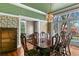 Formal dining room featuring a large table and access to the backyard at 810 S Edison Ave, Tampa, FL 33606