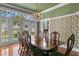 Formal dining room with hardwood floors and large windows at 810 S Edison Ave, Tampa, FL 33606