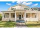 Large two-story home with a wrap-around porch and two-car garage at 810 S Edison Ave, Tampa, FL 33606