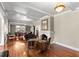 Large living room with hardwood floors, fireplace, and antique furnishings at 810 S Edison Ave, Tampa, FL 33606