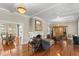 Bright living room features hardwood floors, a fireplace, and views into a formal dining room at 810 S Edison Ave, Tampa, FL 33606
