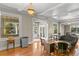 Spacious living room with hardwood floors, high ceilings, and antique furniture at 810 S Edison Ave, Tampa, FL 33606