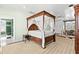 Main bedroom with four-poster bed and ensuite bathroom at 810 S Edison Ave, Tampa, FL 33606