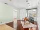 Home office with built-in shelving and hardwood floors at 810 S Edison Ave, Tampa, FL 33606