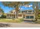Large two-story home with a wrap-around porch and two-car garage at 810 S Edison Ave, Tampa, FL 33606
