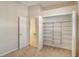 Bedroom with walk-in closet and access to bath at 818 Oak Pond Dr, Osprey, FL 34229