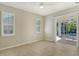 Bright bedroom with sliding glass doors leading to the pool area at 818 Oak Pond Dr, Osprey, FL 34229