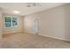 Bedroom with large window, tile floor and access to bathroom at 818 Oak Pond Dr, Osprey, FL 34229