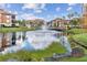 Serene lake with lush landscaping and reflection at 8377 38Th Street E Cir # 308, Sarasota, FL 34243