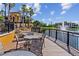 Relaxing lakefront patio with seating and scenic views at 8377 38Th Street E Cir # 308, Sarasota, FL 34243