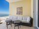 Beachfront balcony with outdoor seating and ocean views at 915 Seaside Dr # 407, Sarasota, FL 34242