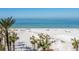 Stunning beach view with white sand and palm trees at 915 Seaside Dr # 407, Sarasota, FL 34242