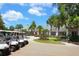 Community clubhouse with golf cart parking at 10202 Marbella Dr, Bradenton, FL 34211