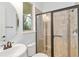 Clean bathroom with a walk-in shower, tile flooring, and a modern vanity at 13148 Bliss Loop, Bradenton, FL 34211