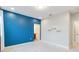 Bedroom featuring a blue accent wall and built-in shelves at 13148 Bliss Loop, Bradenton, FL 34211